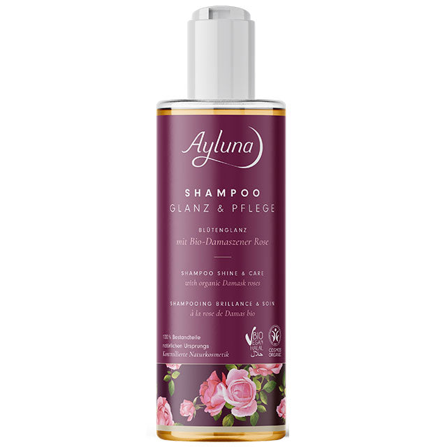 Ayluna Shampoo Sine and Care with organic damask rose is is a plastic bottle with a push down cap