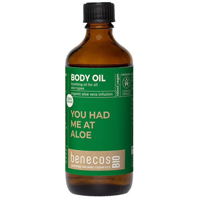 Benecos Bio Body Oil with an aloe vera infusion for all skin types in a brown glass bottle with a green label and a screw top lid