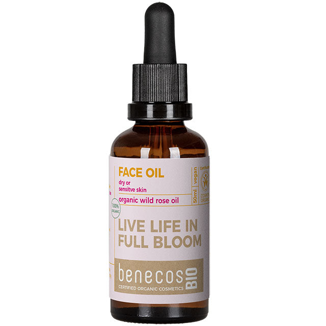 Benecos Bio Face Oil with Organic Wild Rose Oil for dry or sensitive skin. Brown Glass Bottle with a dropper top.
