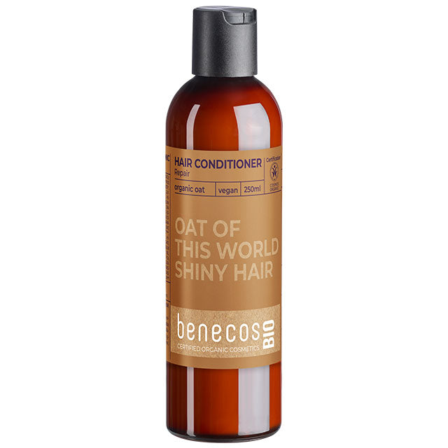 Benecos Bio Oat Repair Conditioner is in a brown bottle on a white background