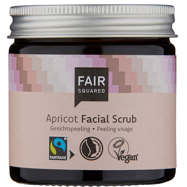 Fair Squared Apricot Facial Scrub is in a brown glass jar with a light pink label and a silver screw top lid