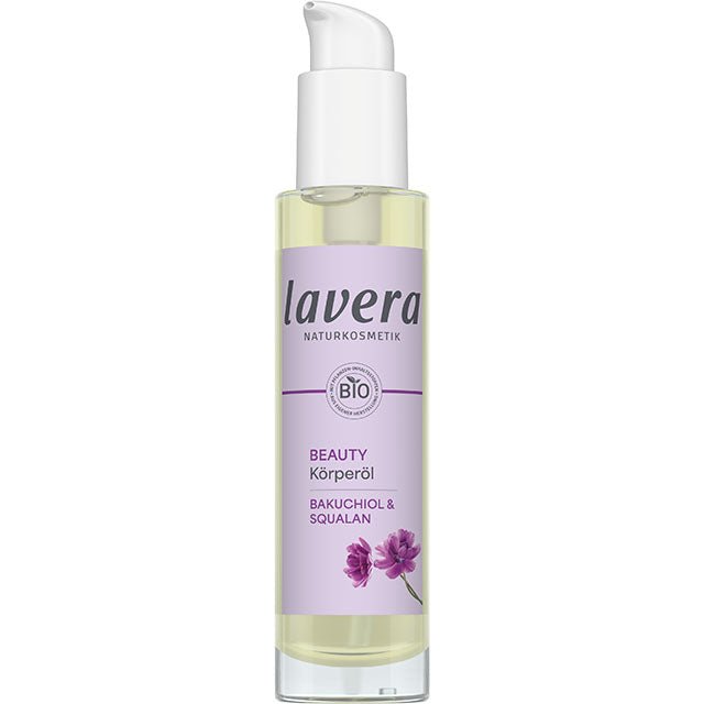 Lavera Beauty Body Oil is in a glass bottle with a purple label and a white spray cap on a white background
