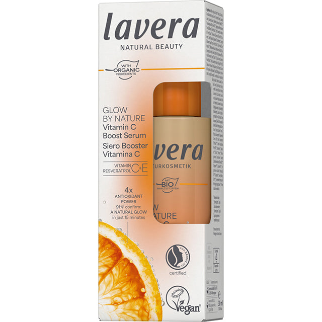 Lavera Glow By Nature Vitasmin C Boost Serum is in a white cardboard box with a slice of orange on a white background
