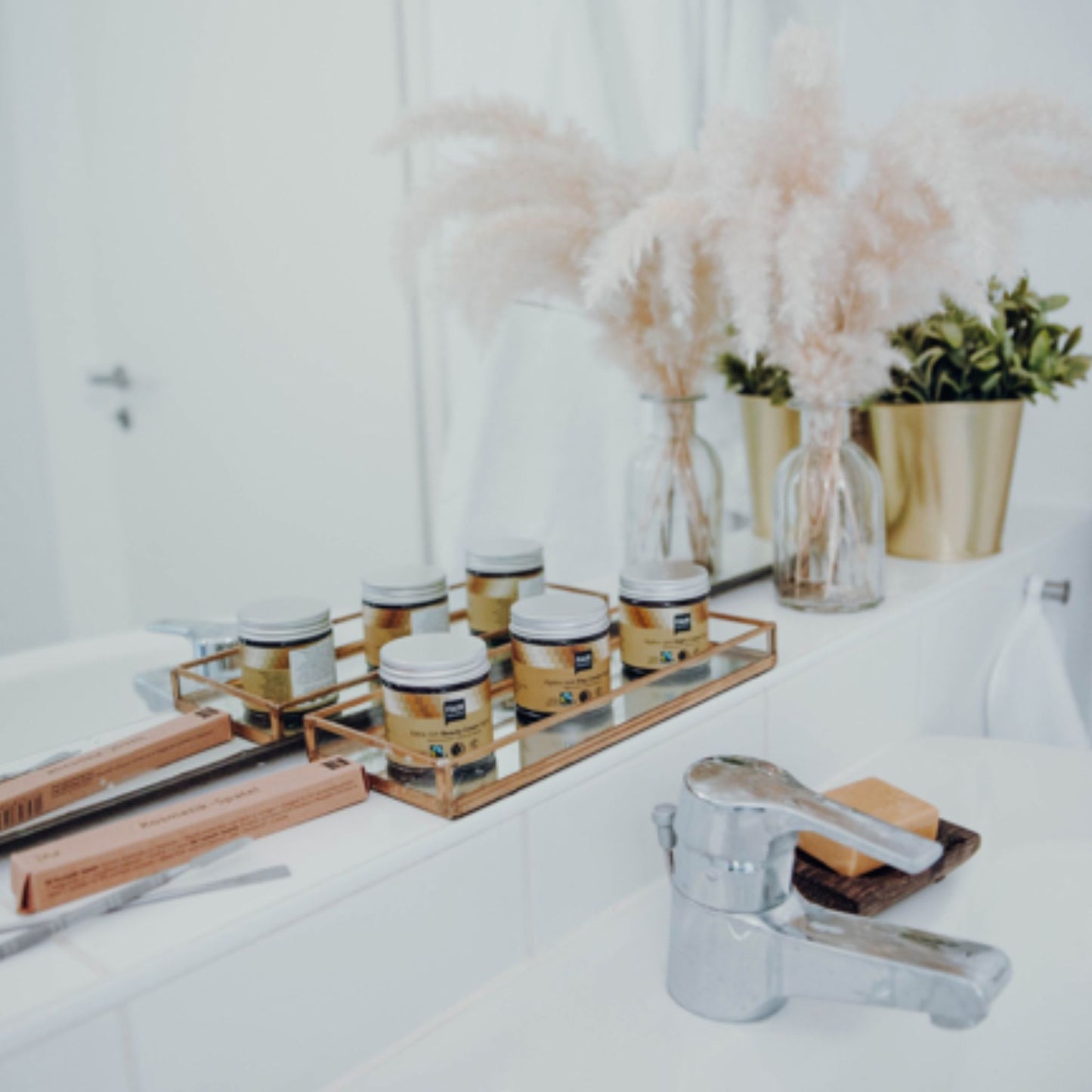 Fair Squared face creams in bathroom with mirrored background