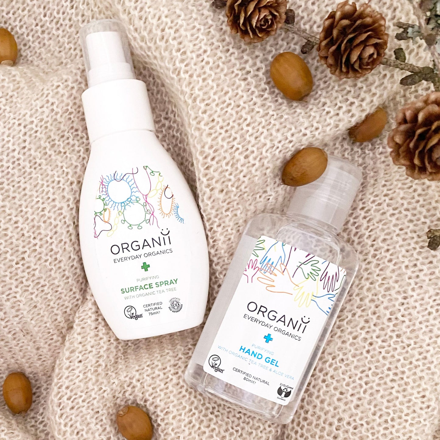Organii Purifying Hand Gel with Purifying Surface Spray on beige blanket