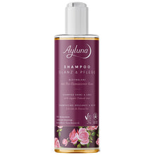 Ayluna Shampoo Sine and Care with organic damask rose is is a plastic bottle with a push down cap