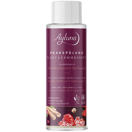 Ayluna Shine and Easy Comb Conditioner with organic pomegranate and organic burndock root is in a plastic bottle with a push down cap