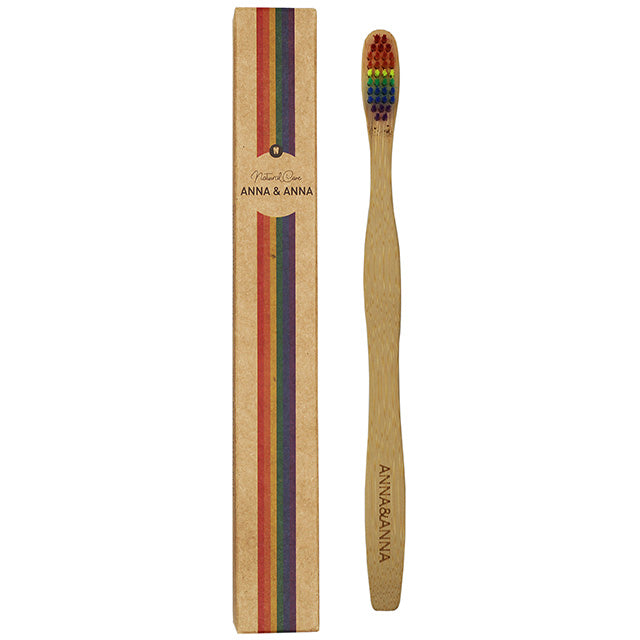 Ben and Anna Bamboo Toothbrush with Anna and Anna written on the handle. A rainbow coloured nylon bristle head in a box. 