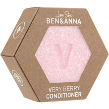 Ben and Anna Love Soap Very Berry Conditioner is in a hexagonal cardboard box with a hexagonal front cut out showing the pink speckled soap bar with a V 
