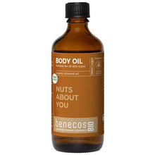 Benecos Bio Body Oil with organic almond oil  for all skin types in a brown glass bottle with a light brown label and a screw top lid.