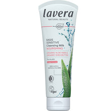 Lavera Basis Sensitive Cleansing Milk is in a white tube with black and red writing with a aloe vera leaf on a white background