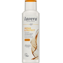 Lavera Repair and Protect Shampoo for Dry and Damaged Hair is in a white bottle with organge flip top cap and black and orange writing on a white background