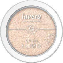 Lavera Soft Glow Highlighter Champagne Shimmer 01 is in a white pressed powder compact with a clear lid, on a white background.