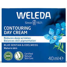 Weleda Contouring Day Cream is in a blue and white box with blue flowers on a white background 