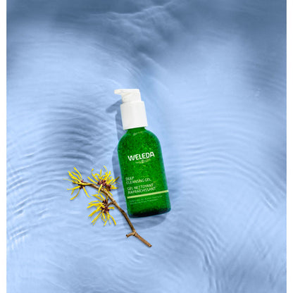 Weleda Deep Cleansing Gel with organic aloe vera and organic witch hazel in a green glass bottle on a blue background