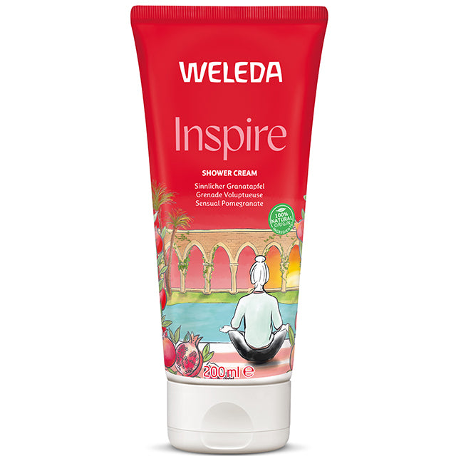 Weleda Inspire Shower Cream in a red tube on a white background