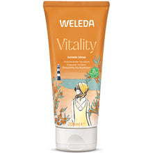 Weleda Vitality Shower Creamis in a orange tube with a white flip top lid on a white background