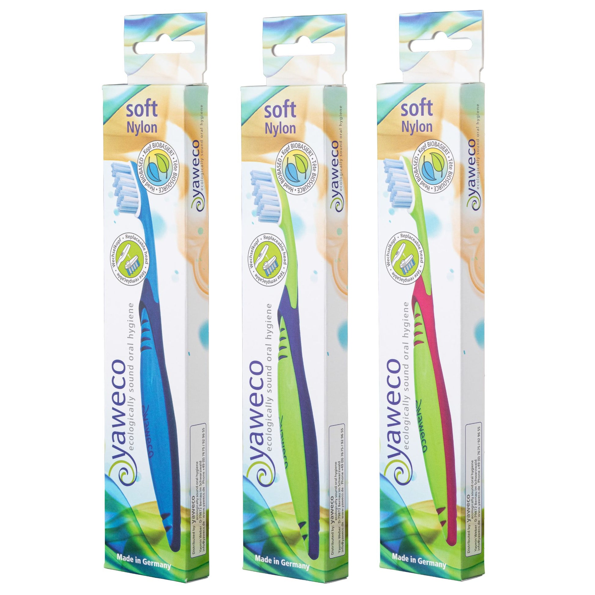 Three packages of Yaweco soft nylon bio-based toothbrushes on a white background