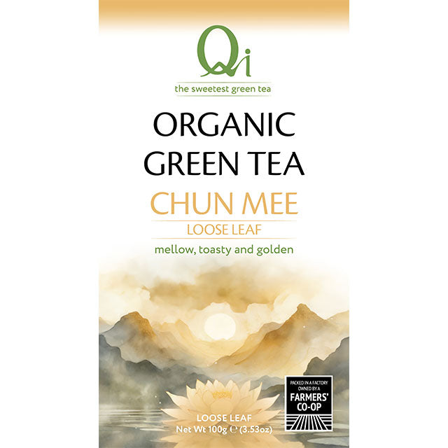 Tea package for Qi Organic Green Tea Chun Mee with a scenic design on a white background