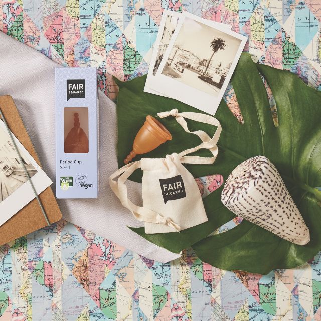 Period cup product packaging with 'FAIR Squared' branding on a map background