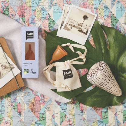 Period cup product packaging with 'FAIR Squared' branding on a map background