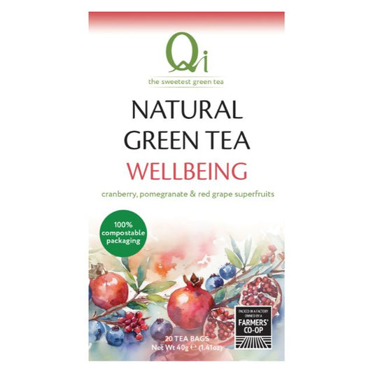 Qi Natural Green Tea Wellbeing packaging with cranberry, pomegranate, and red grape superfruits on a white background.