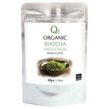 Packaging of Qi Organic Matcha green tea powder on a white background