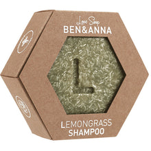 Ben and Anna Love Soap Lemongrass Shampoo is a bar soap in an hexagon shaped brown box with a haxagon shaped cut out revealing the soap bar which has an L in the middle of the bar shampoo