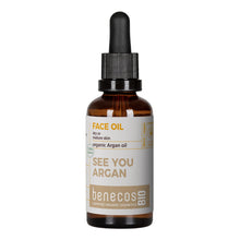 Benecos Bio Face Oil with Organic Argan Oil for dry or mature skin. Brown Glass Bottle with a dropper lid on a white back ground.