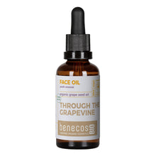 A bottle of benecos Bio Organic Grape Face Oil 'Through the Grapevine' organic grape seed oil in an amber glass dropper bottle with a black cap and white label.