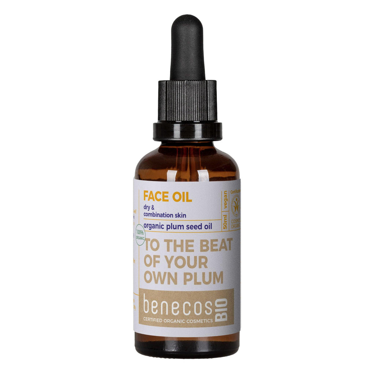 A bottle of Benecos Bio Face Oil made from organic plum seed oil, featuring an amber glass bottle, a black dropper cap, and a white label with brown and yellow text.