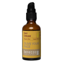 A 50ml amber glass bottle of benecos BIO Day Cream with a black dropper cap and a mustard yellow label, set against a plain white background.