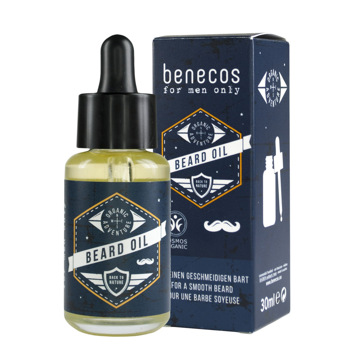 A bottle of Benecos beard oil with a black dropper cap stands in front of its matching dark blue and white retail box on a plain white background.