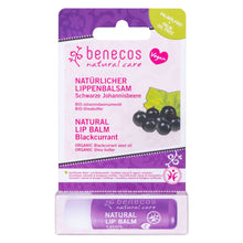 Benecos Natural Care blackcurrant lip balm in its original retail packaging, featuring a purple and white card with a green palm oil-free badge and a matching purple tube inside a paper case.