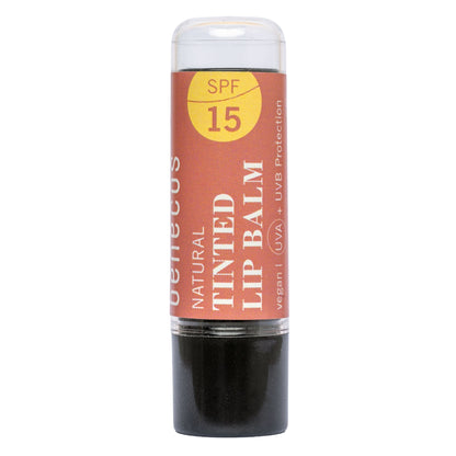 A single stick of Benecos Natural Tinted Lip Balm SPF 15, featuring a terracotta orange label with white and yellow text, and a black balm stick visible at the bottom, set against a plain white background.