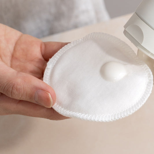 lavera basis sensitive cleansing milk on white cotton pad