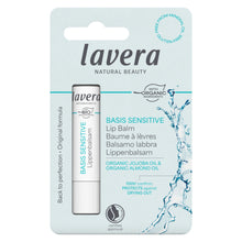 Lavera Basis Sensitive Organic Jojoba Oil and Almond Oil Lip Balm in its original retail blister packaging, featuring a white tube with blue and black text on a light blue card.