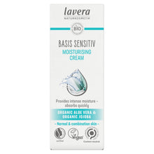 A tall rectangular box of Lavera Basis Sensitiv Moisturising Cream on a plain white background. The packaging is white with teal and dark gray text, featuring a water droplet graphic in the center and various certification logos at the bottom.
