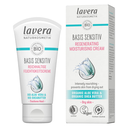 Lavera Basis Sensitive Regenerating Moisturising Cream shown as a white squeeze tube next to its matching white packaging box, featuring teal and pink text and a water droplet graphic.