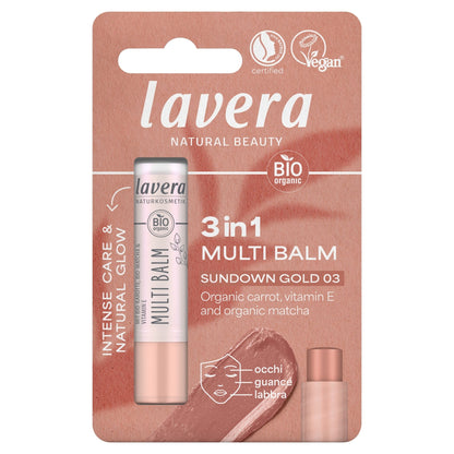 A single stick of Lavera 3-in-1 Multi Balm in the Sundown Gold 03 shade, mounted on its original retail blister card packaging. The packaging features a dusty rose and brown gradient background with white text and certification logos.