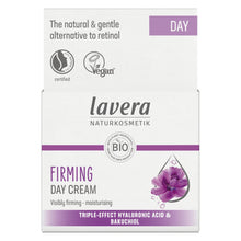 Lavera Firming Day Cream packaging box, featuring a white design with purple accents, a purple flower illustration, and text highlighting key ingredients and benefits.