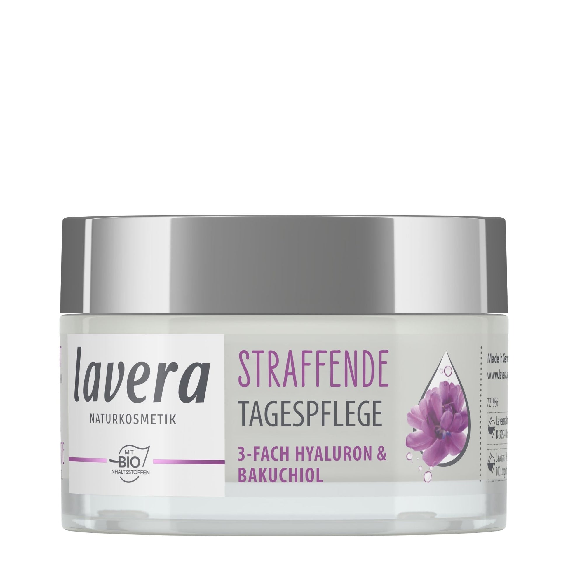 A jar of Lavera Firming Day Cream, daily care cream with a silver lid and a white label featuring purple text and a purple flower graphic, set against a plain white background.