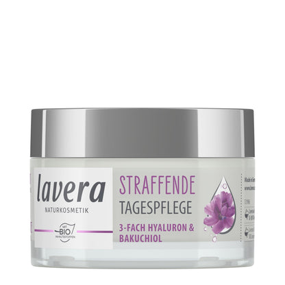 A jar of Lavera Firming Day Cream, daily care cream with a silver lid and a white label featuring purple text and a purple flower graphic, set against a plain white background.