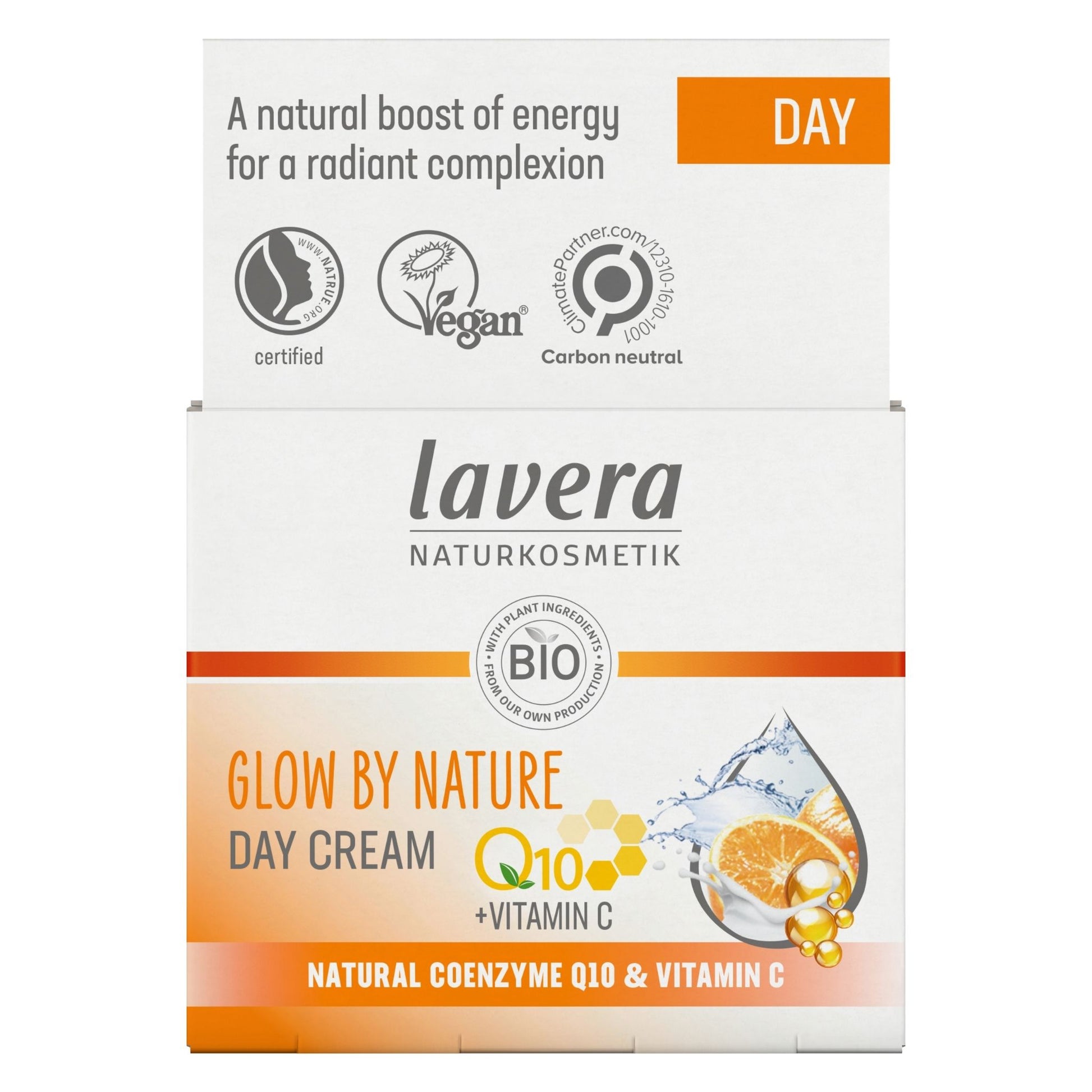A box of Lavera Glow By Nature Day Cream, featuring a white and orange design with product details and ingredient imagery.