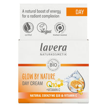 A box of Lavera Glow By Nature Day Cream, featuring a white and orange design with product details and ingredient imagery.