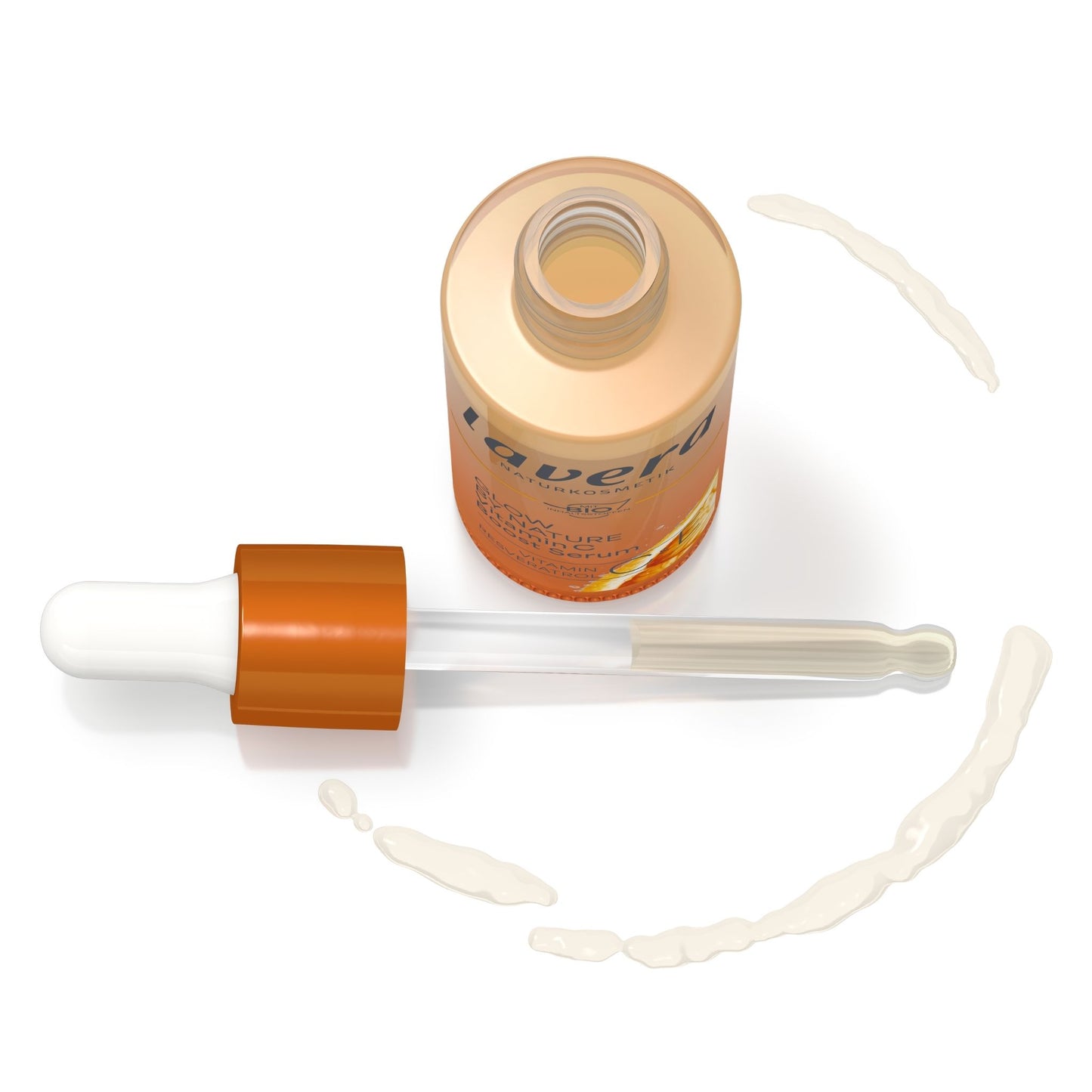 A bottle of Lavera Glow by Nature Boost Serum with its dropper cap removed, placed on a white background with several streaks of the white serum applied around it.