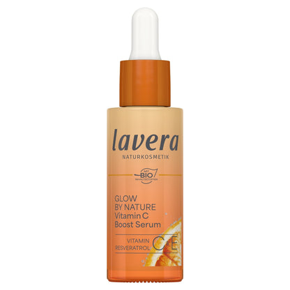 Lavera Glow by Nature Vitamin C Boost Serum in a dropper bottle, featuring a warm orange and beige gradient label with a white dropper cap.