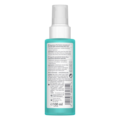 Back view of a 100 ml spray bottle with a white spray top and a translucent turquoise body, showing printed product information on a white background.