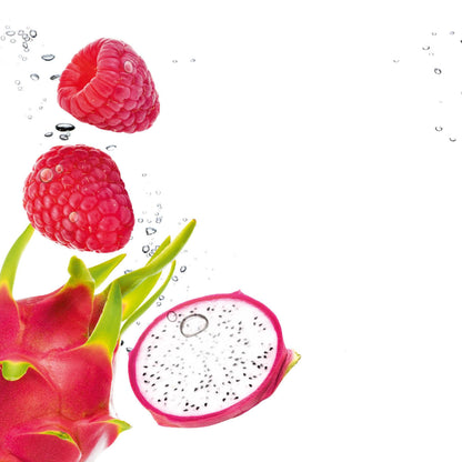 Fresh raspberries and a sliced dragon fruit with green leaves, photographed floating in bubbles on a white background.