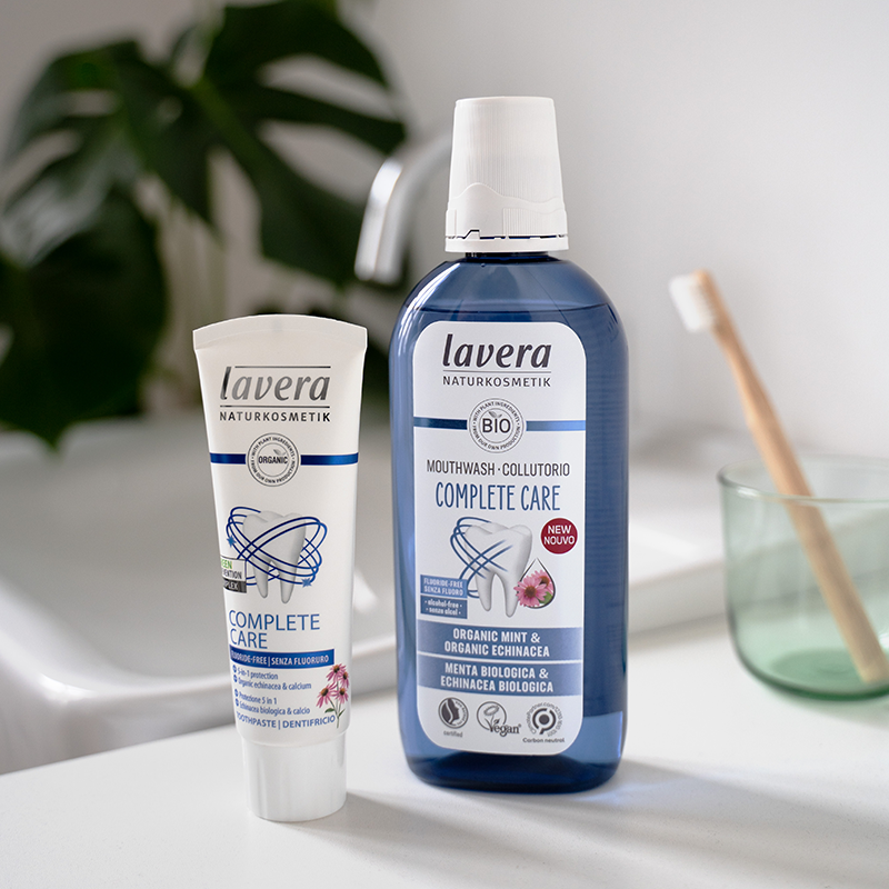 Lavera Complete Care Toothpaste and Lavera Mouthwash Complete Care together on a bathroom shelf
